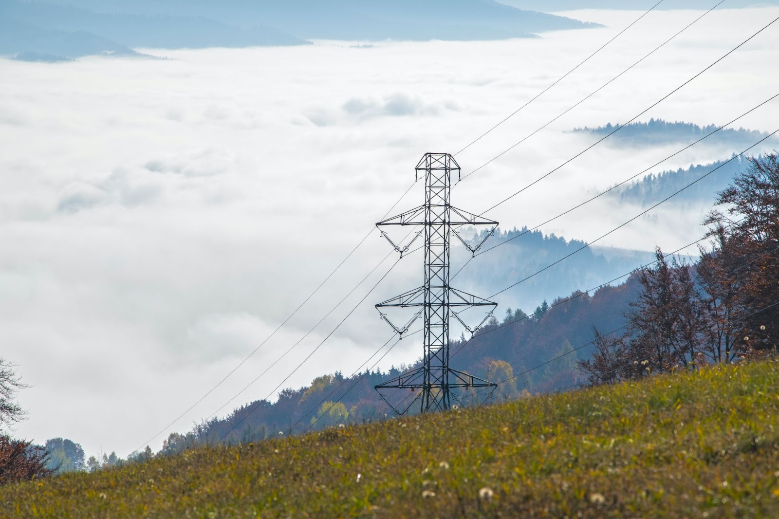 Electricity lines and pylon on a hill